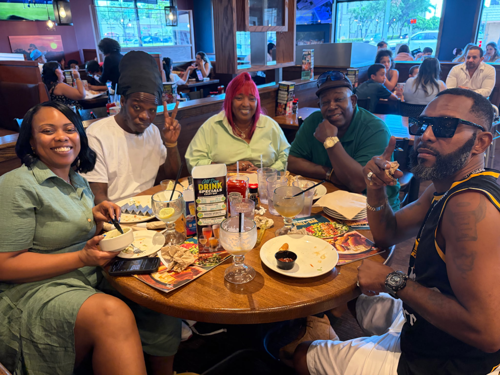 Michael and family gathered around a restaurant table