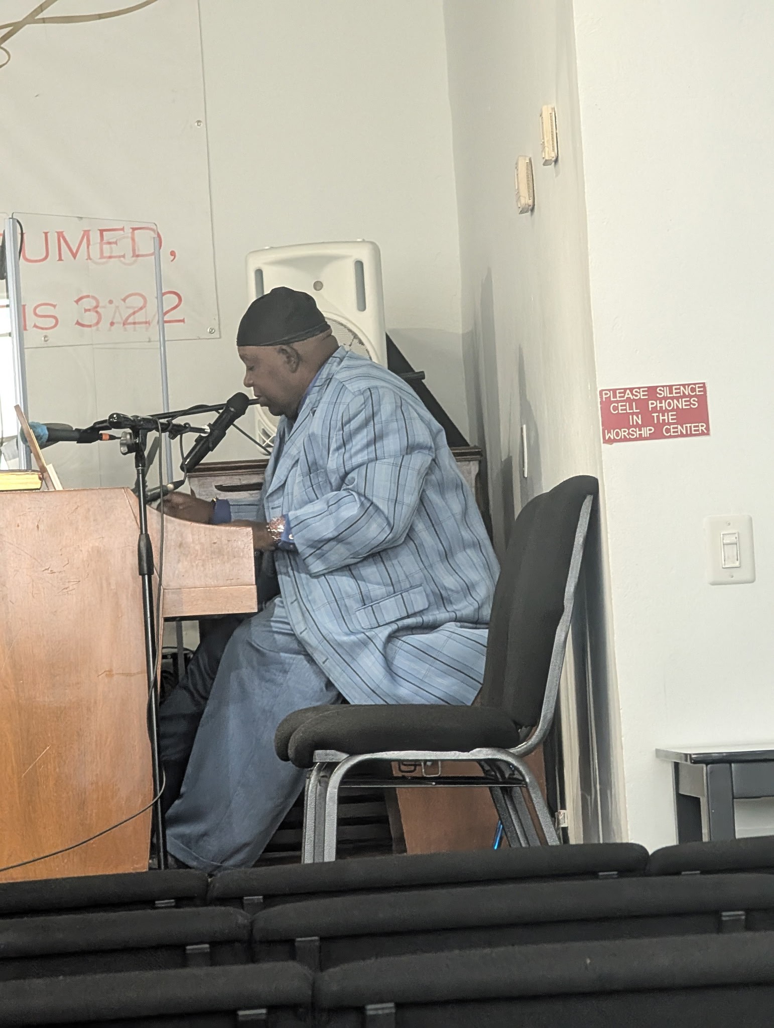 At the keyboard in blue.